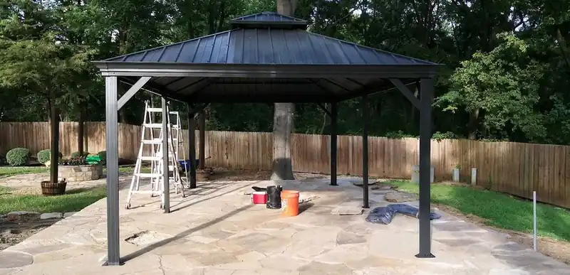 Steel-roof gazebo built on a flagstone patio