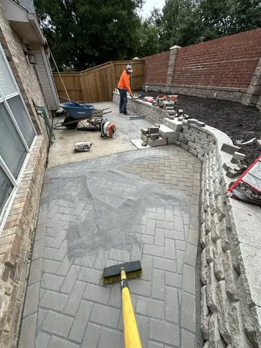 Paver side-yard patio being finished by the crew