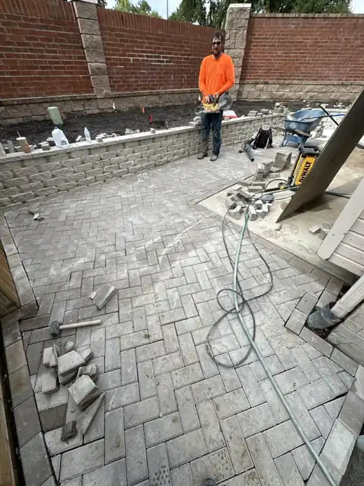 A herringbone paver walkway under construction by the Hoyer's crew